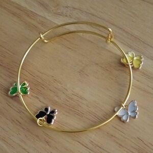 Hand Crafted Gold Butterfly Charm Bangle with Green, Black, White, Yellow Charms